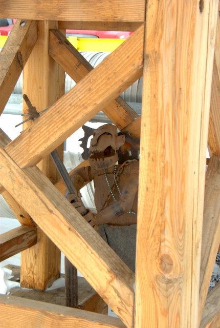 Metal Troll Sculpture hiding under a walk bridge